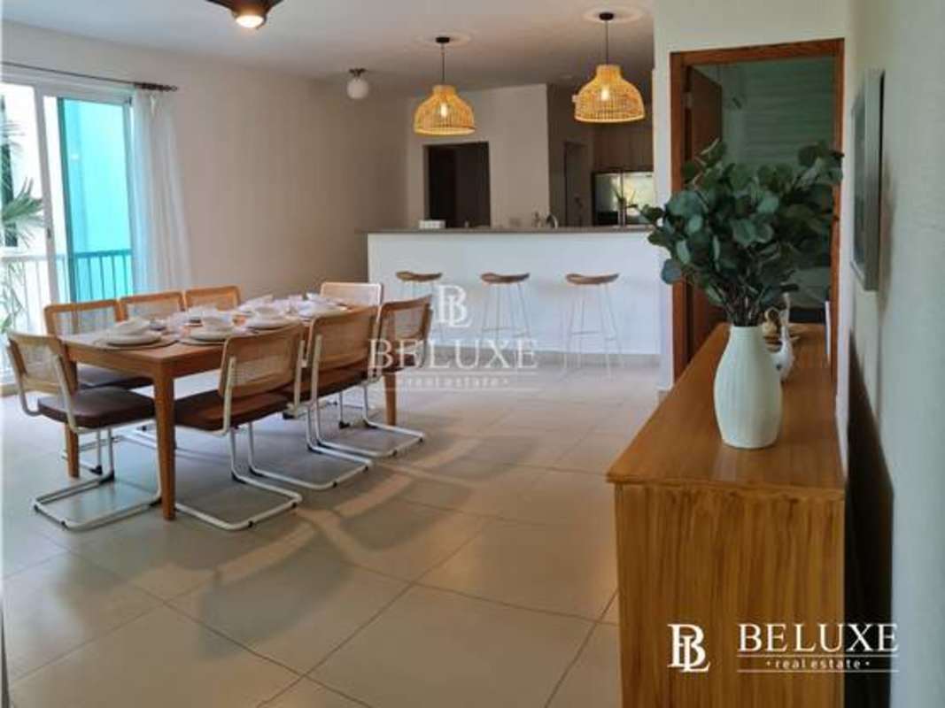 Bright spacious bedroom with AC and window view at Bijao PH Balboa 1 beach apartment Panama