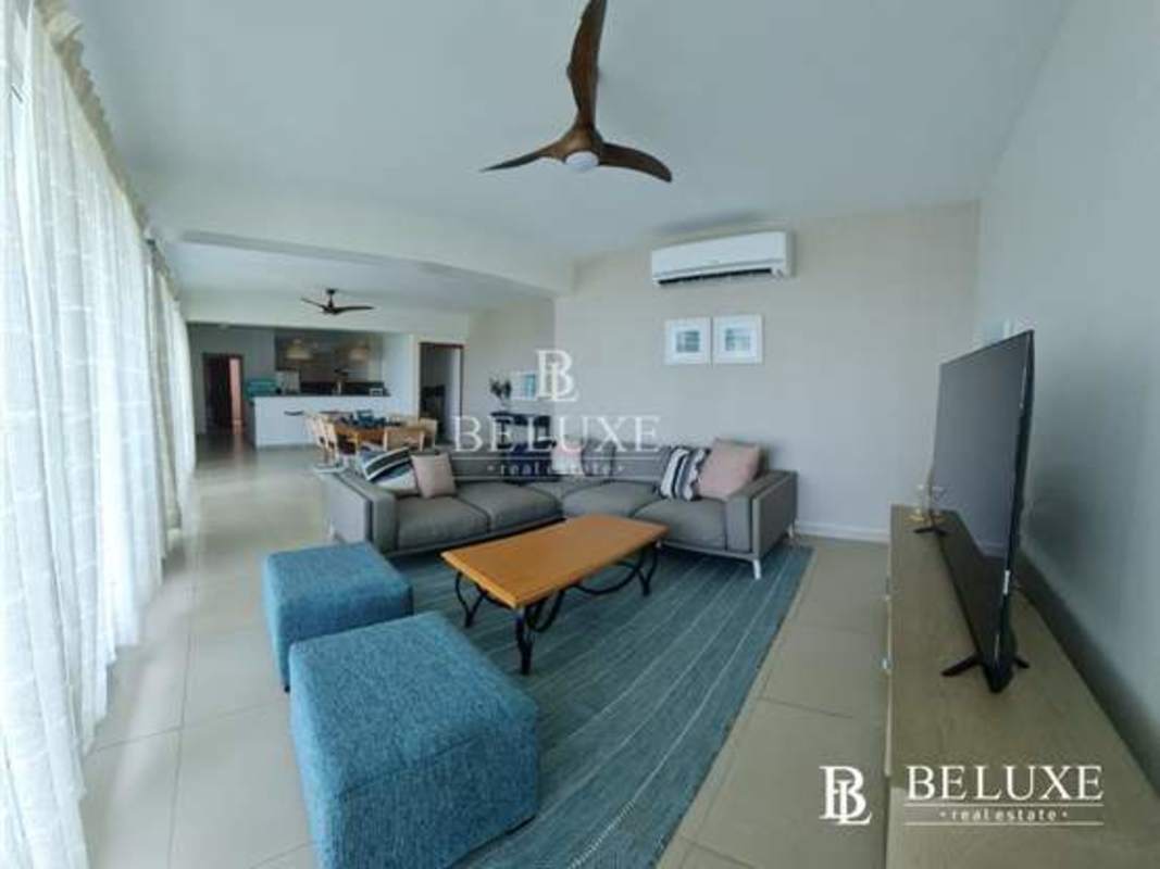Spacious living room with large windows, AC, balcony access in Bijao Balboa 1 Panama