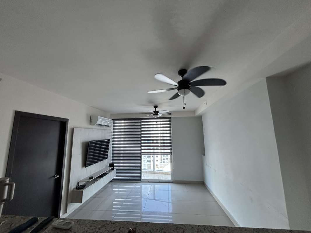 Modern living room with TV wall mount and window blinds in PH San Roque