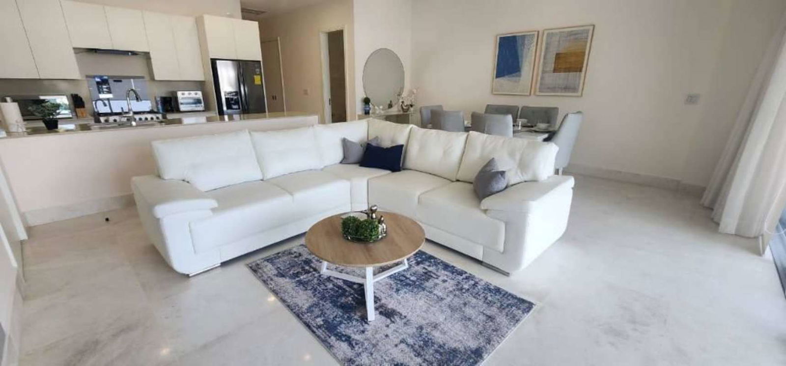 Luxury apartment kitchen with island, quartz countertops and appliances Ocean Reef Islands Panama