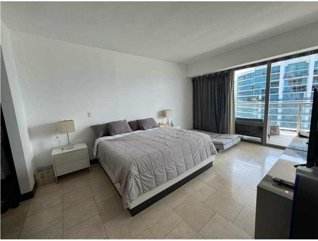 Open concept living dining with ocean view balcony at JW Marriott Panama Punta Pacífica luxury condo