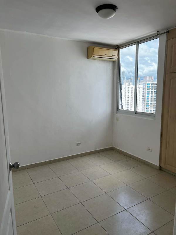 Secondary bedroom with window, closet space and tiled floor PH El Cangrejo apartment
