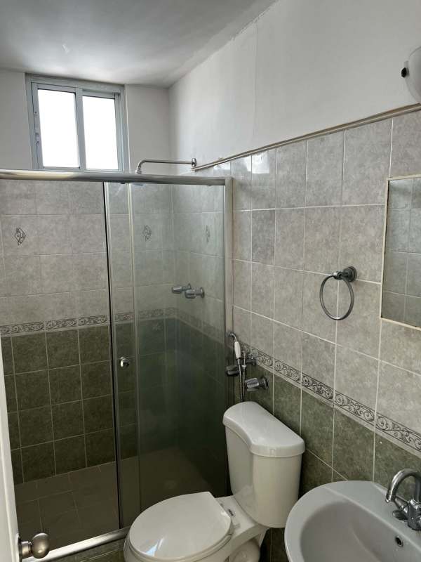 Traditional bathroom glass shower enclosure, pedestal sink in PH El Cangrejo Panama