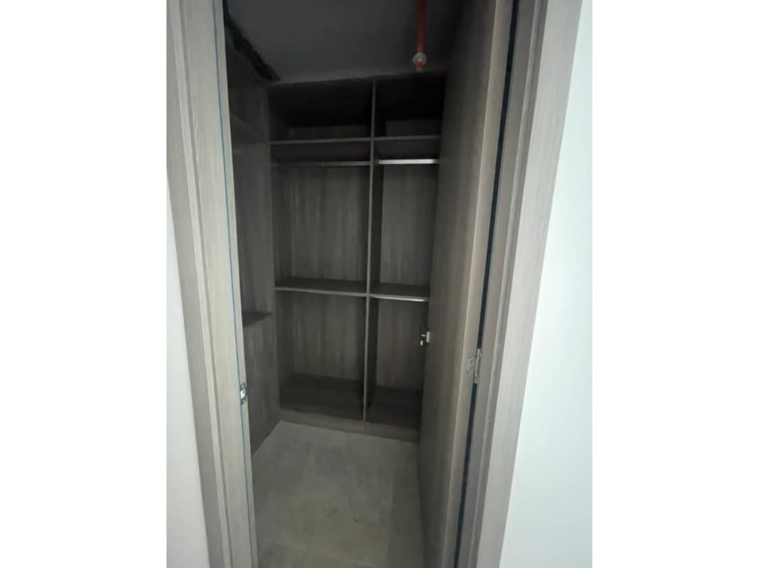Modern walk-in closet with shelves and storage PH Ocean Front Punta Paitilla Panama