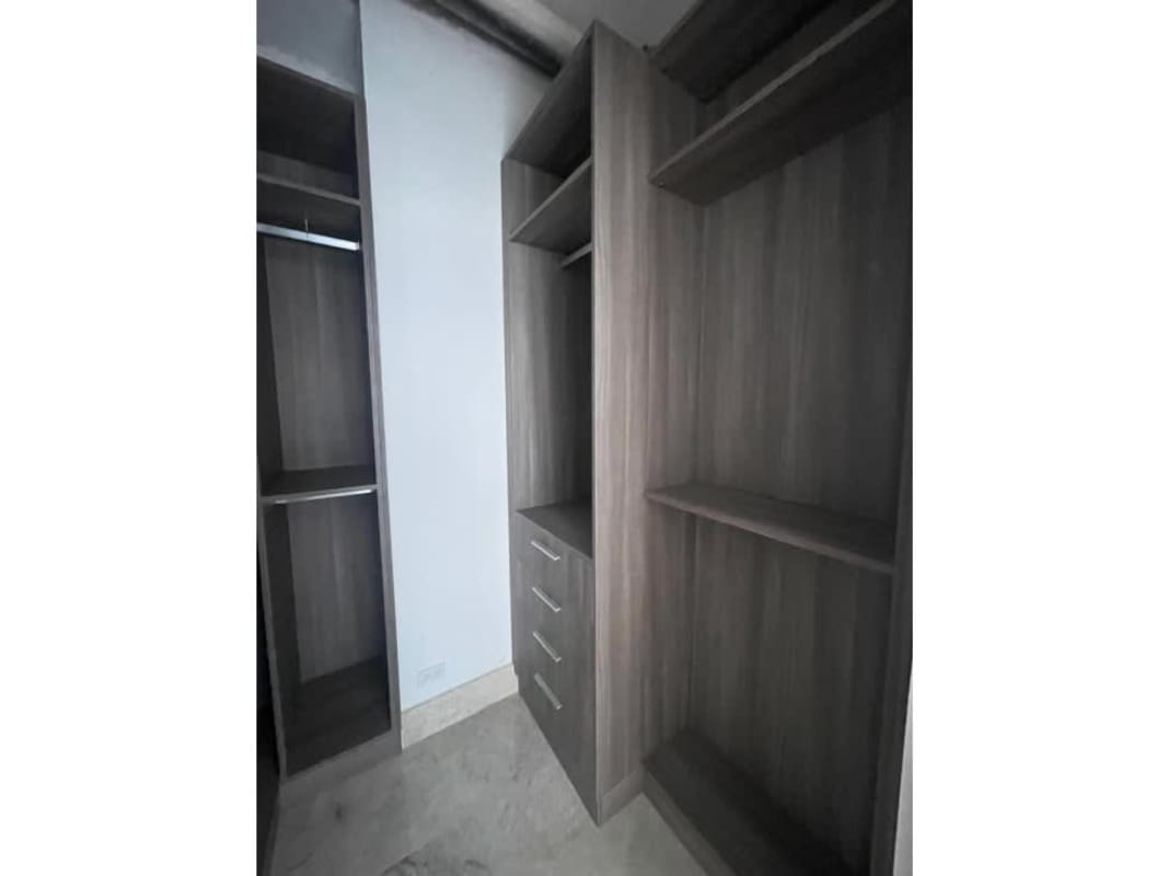 Modern walk-in closet with built-in shelves in PH Ocean Front Punta Paitilla Panama City