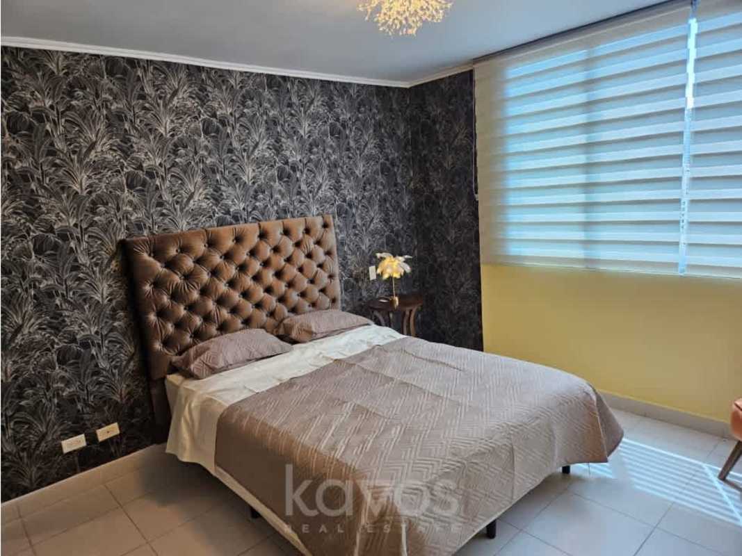 Bedroom with city view, large windows and modern furniture PH Miró El Cangrejo Panama