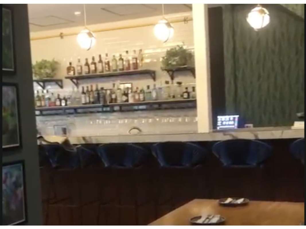 Modern lounge and bar with marble countertop, velvet stools Obarrio Business Center Panama City