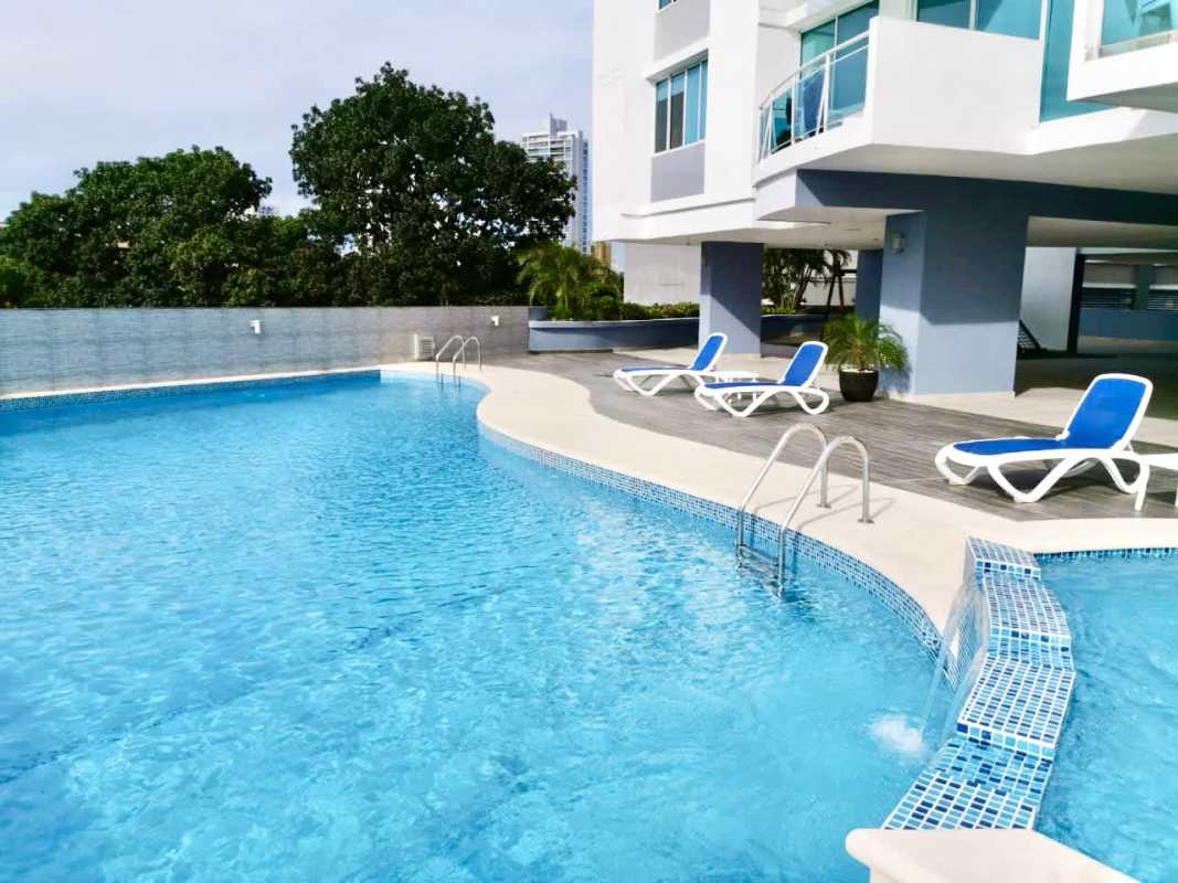Outdoor swimming pool with jacuzzi waterfall feature and sun deck at PH Mont Royale El Cangrejo Panama
