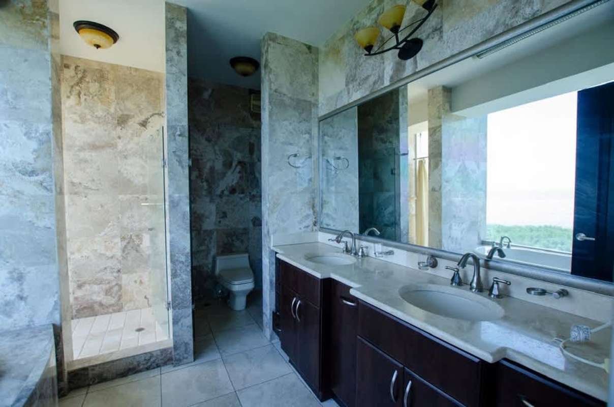 Spacious bedroom with large windows, closet, ocean and skyline views PH Matisse Costa del Este Panama