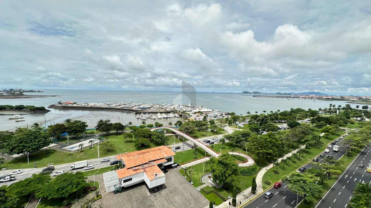 Bedroom with floor-to-ceiling windows overlooking Pacific Ocean in Sky Residences apartment Panama