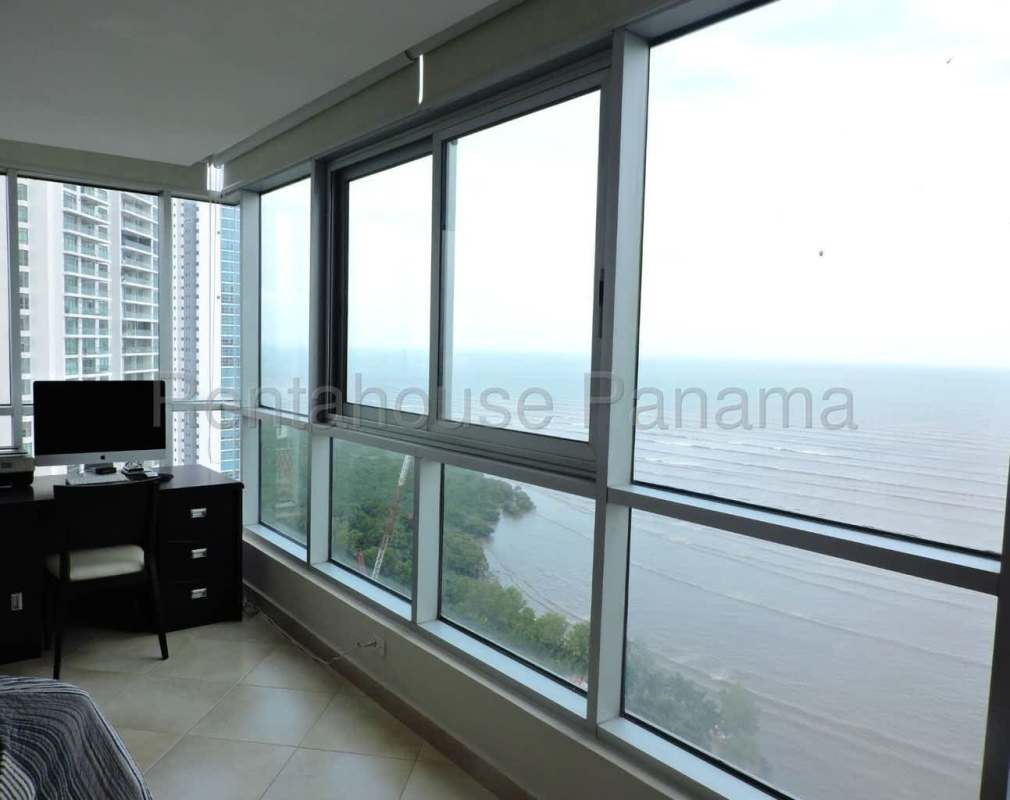 Spacious bedroom with large window, walk-in closet, balcony and ocean views in PH Costanera Costa del Este Panama City
