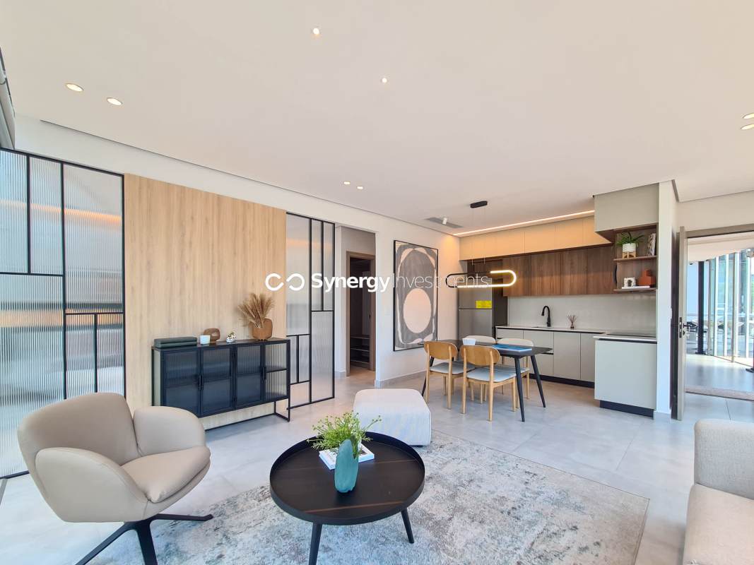 Open concept living dining space with floor-to-ceiling windows at PH City Suites Costa del Este