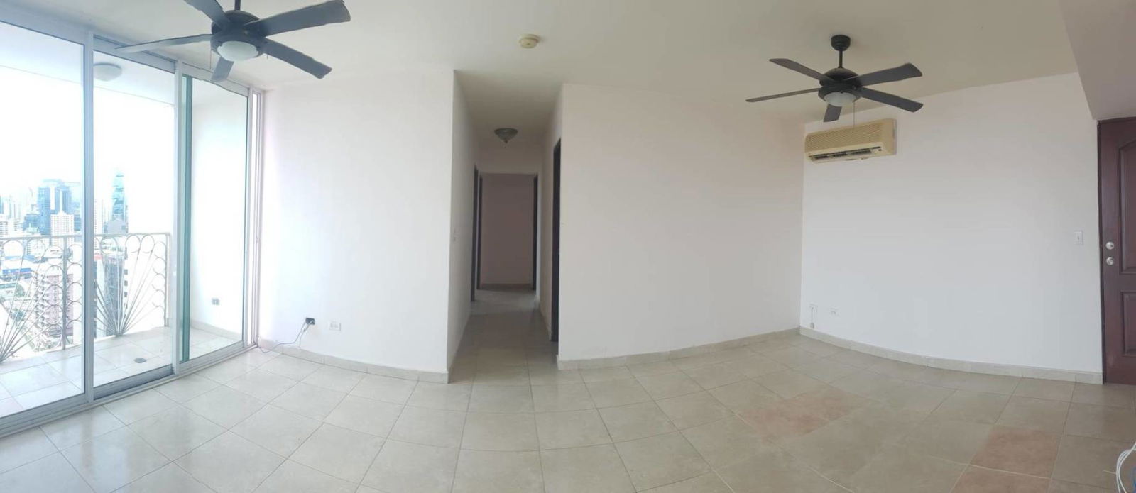 Bright living space with sliding doors to balcony overlooking city PH El Cangrejo Panama City