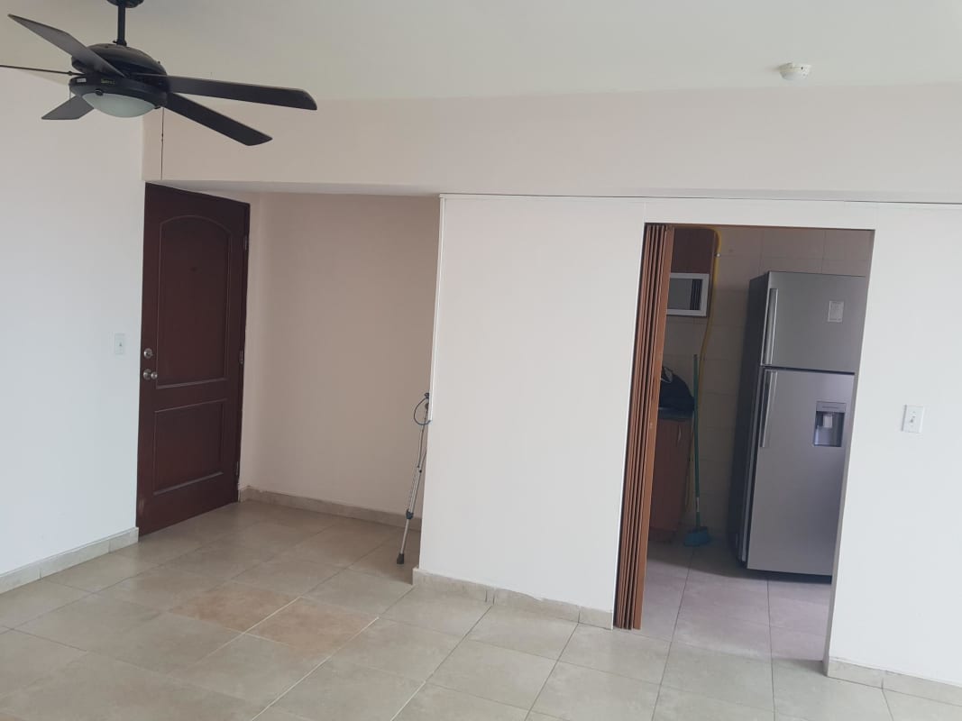 Open living room with partial kitchen view in PH El Cangrejo apartment Panama City