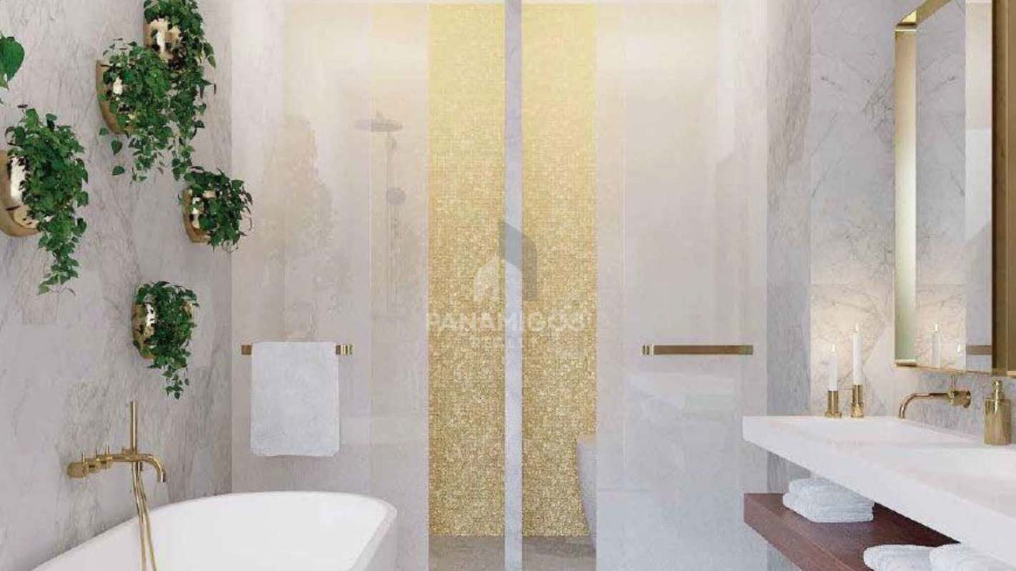 High-end bathroom with marble walls, gold fixtures, freestanding tub at PH Wanders & Yoo
