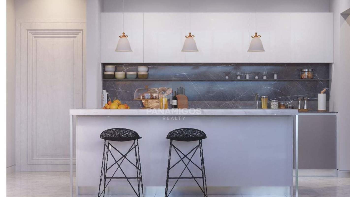 Minimalist kitchen with marble island counter and backsplash at PH Wanders & Yoo Panama