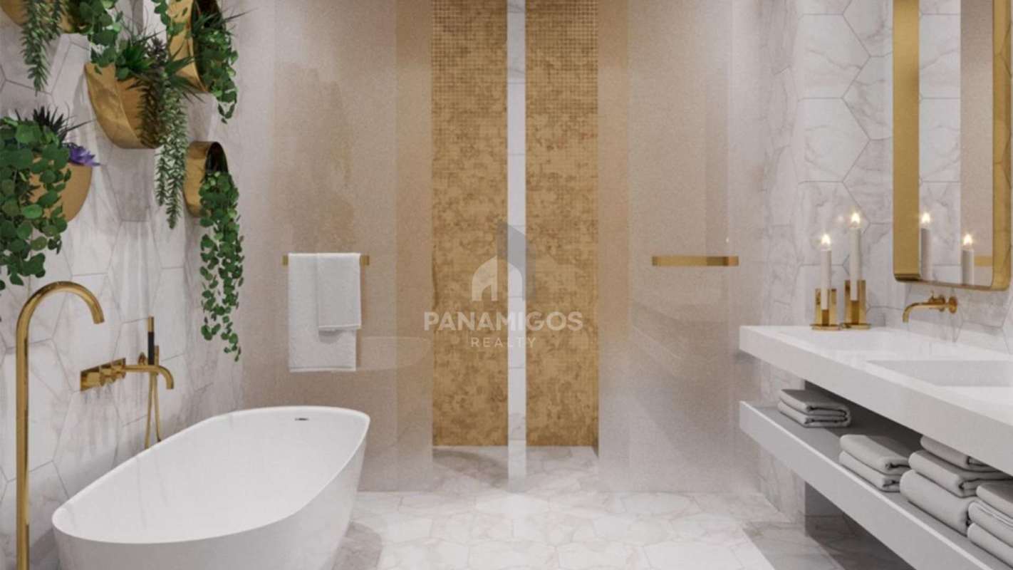 Luxury bathroom featuring marble finishes, gold hardware, freestanding tub in PH Wanders & Yoo Panama