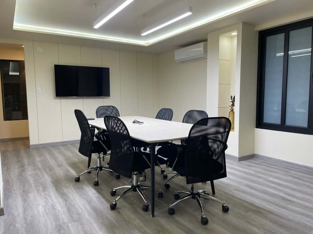 Conference room with mounted screen AC and lighting office commercial rental Panama City
