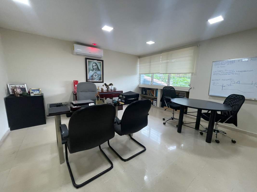 Large open workspace office with windows blinds wood floors and workstations Panama City