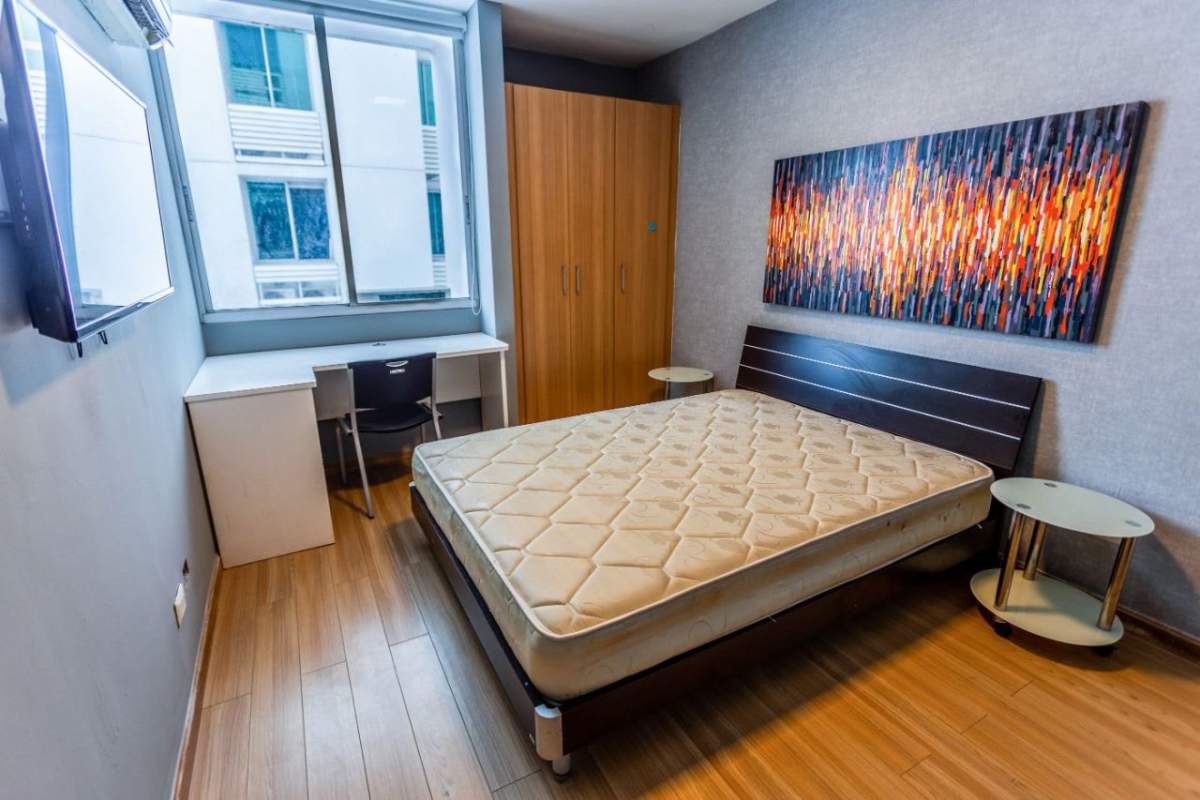 Bright bedroom with city view study area PH Pacific Sky Punta Paitilla Panama