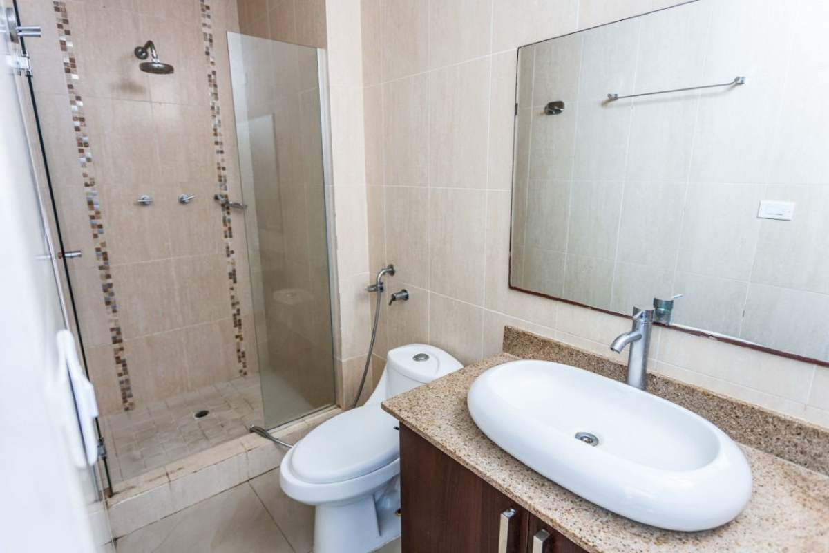 Contemporary bathroom with glass shower granite sink PH Pacific Sky Punta Paitilla