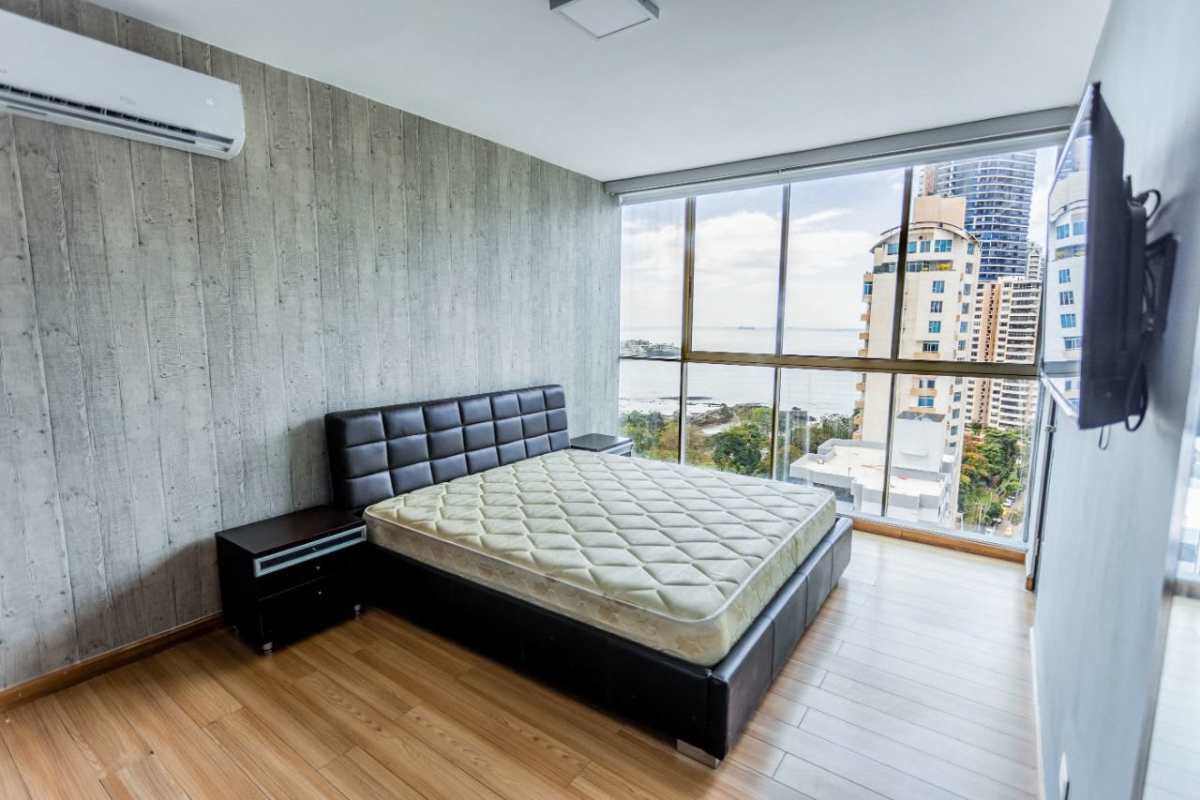 Bedroom with floor-to-ceiling windows ocean city view PH Pacific Sky Punta Paitilla