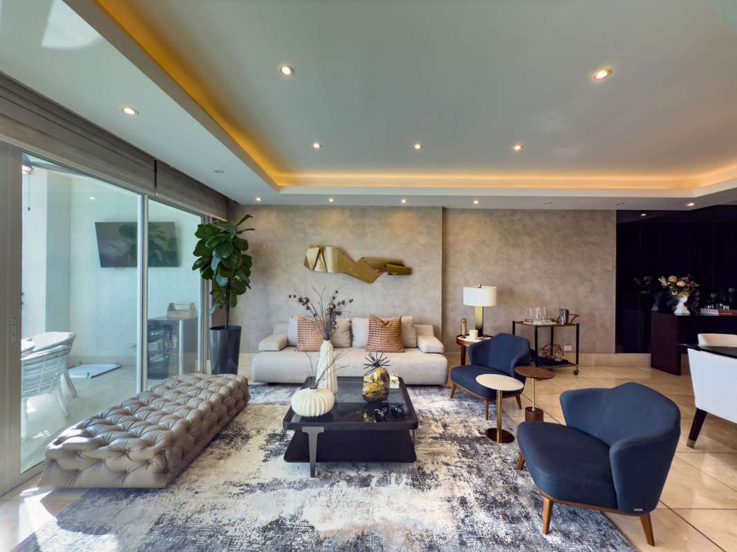Modern bathroom with dual sinks and glass shower in Santa María Panama