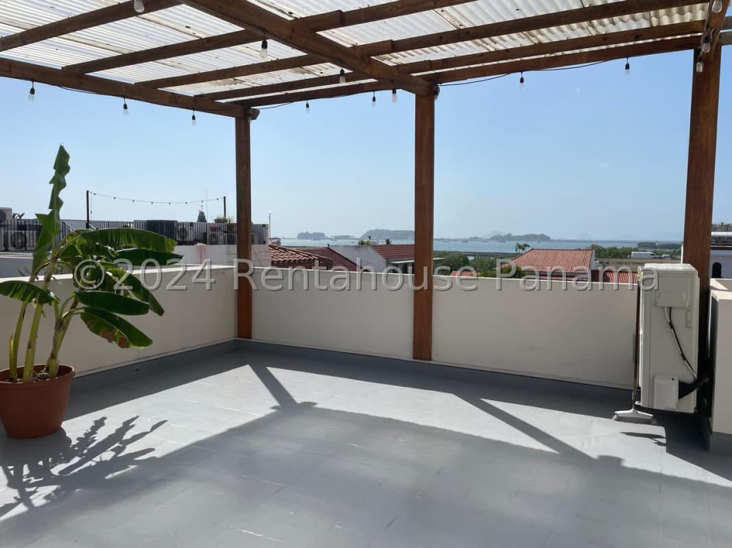 Contemporary kitchen with granite countertops, wood cabinets, microwave, stainless steel stove Casco Viejo Panama