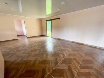 Expansive yard with green grass surrounding house in Potrerillos Chiriqui Panama