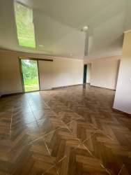 Bright kitchen with window and wooden cabinets in Potrerillos Chiriqui Panama