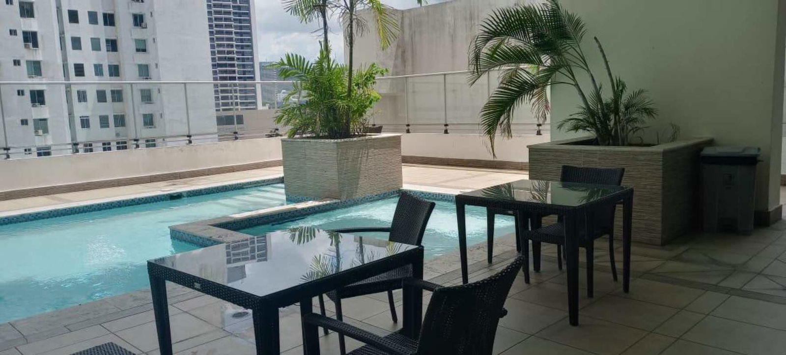 Condo lounge with seating next to gym glass wall PH Belle View Bella Vista Panama