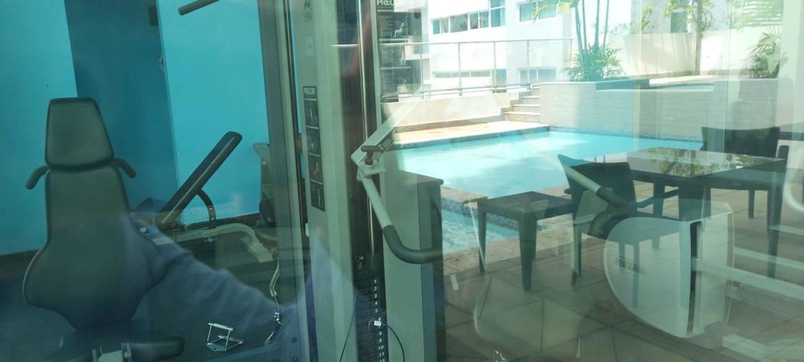 Swimming pool with city views glass railing palm landscaping PH Belle View Bella Vista