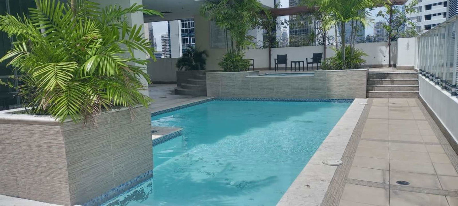 Gym with workout equipment and pool view PH Belle View Bella Vista Panama