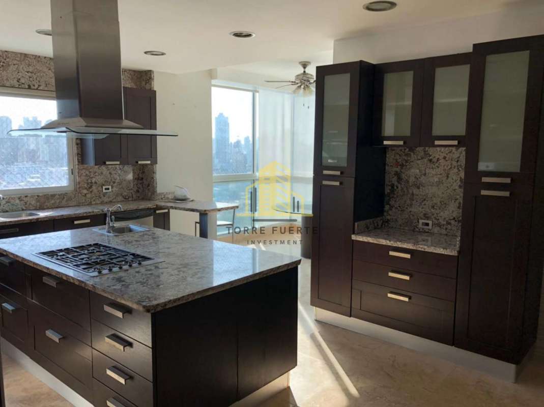 Luxury kitchen with granite island, oven, and modern cabinetry in PH Puntarenas Coco del Mar Panama