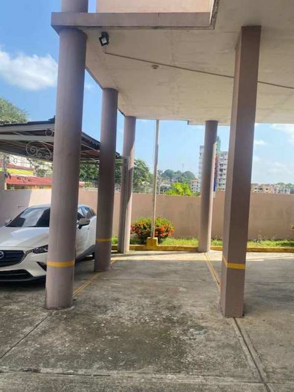 Covered parking space and driveway with security lighting inside PH Brisas del Sur Panama City