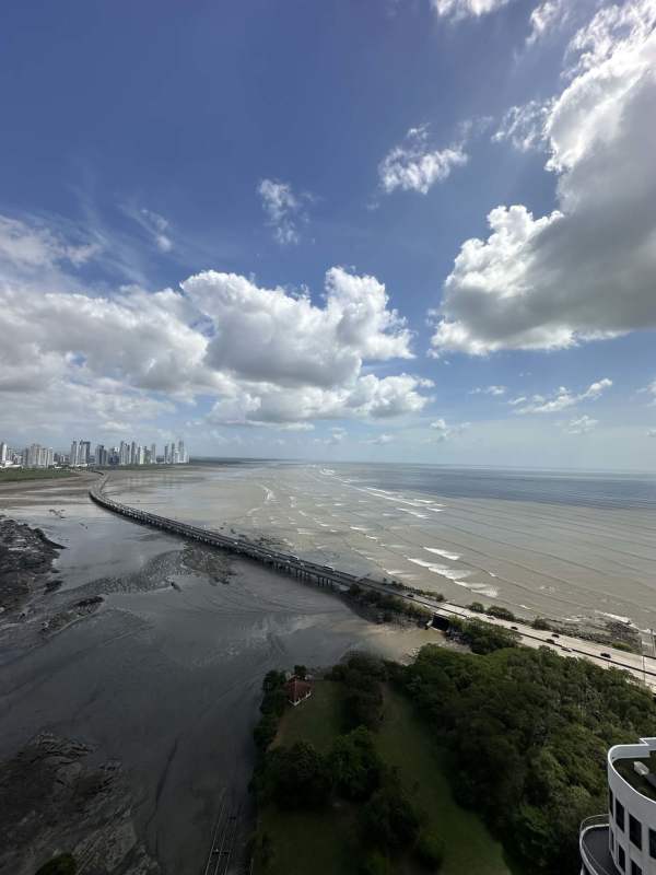 Aerial image showing PH Ocean Sky tower, Coco del Mar neighborhood and Pacific Ocean in Panama City
