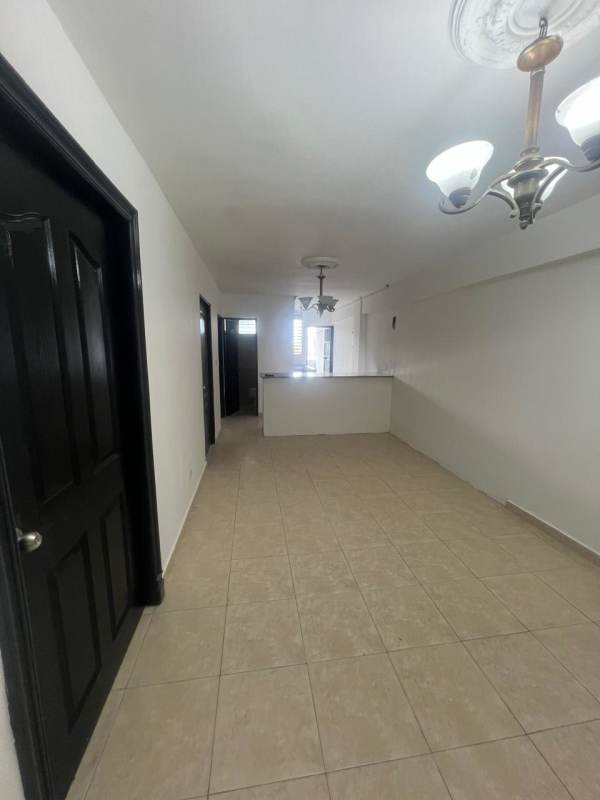 Bright living and dining room with ceramic tiled floors near Vía España Panama City