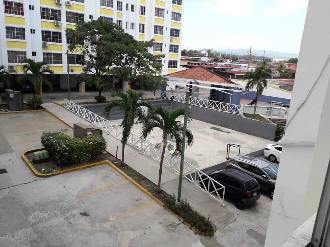Exterior view of PH Mystic Hills with landscaped parking area Via Tocumen Panama