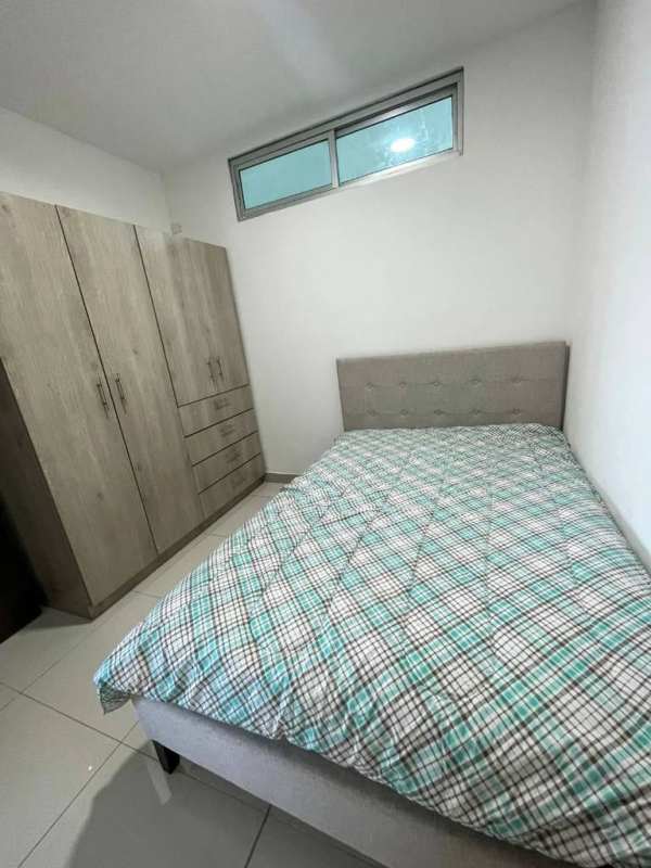 Small minimalist bedroom tiled floor bright window Costa del Este