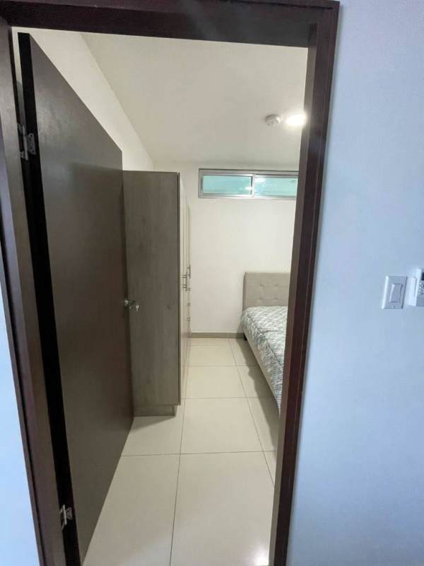 Compact bedroom with window and wardrobe Costa del Este Panama rental