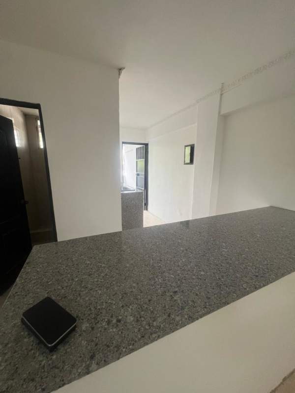 Minimalist granite countertop kitchen in Rio Abajo Panama apartment