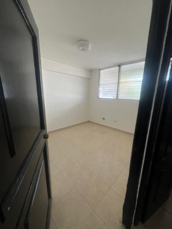 Bedroom featuring window louvers and tiled floors in Rio Abajo Panama