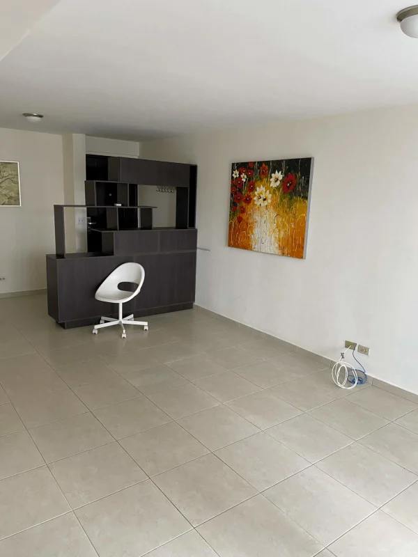 Bright living room with sliding door to balcony in PH Villa de las Fuentes Panama City