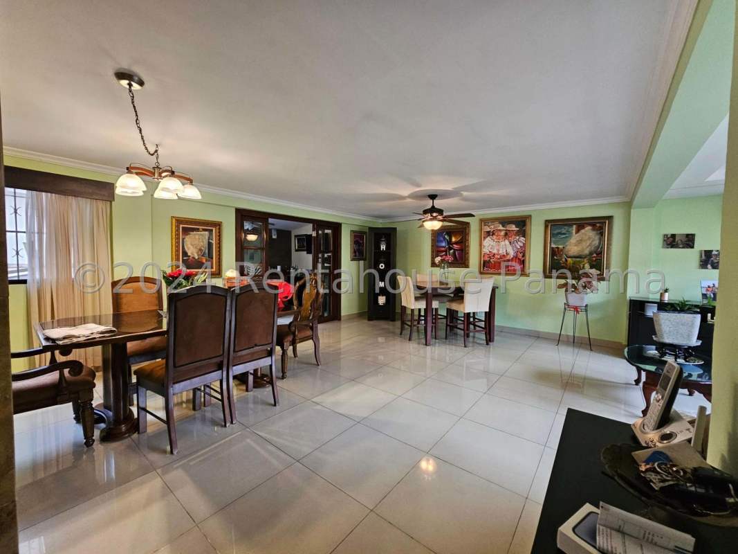Spacious traditional living and dining room with ceramic tiles large windows and classic decor Altos del Golf Panama