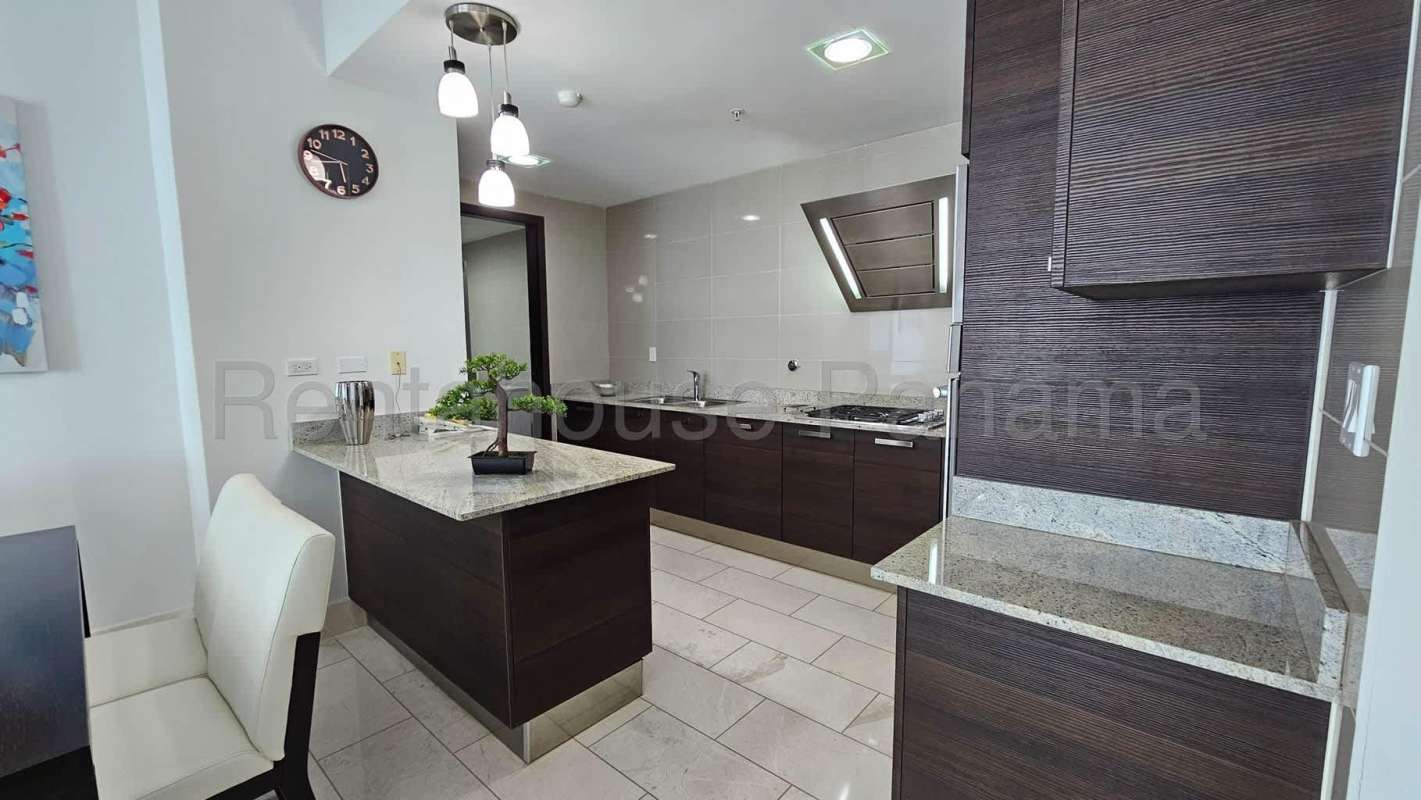 Bright living room with marble flooring and ocean view windows in luxury PH Ocean Club Panama