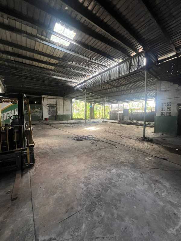Warehouse interior view empty with high metal roof and concrete flooring Panama City