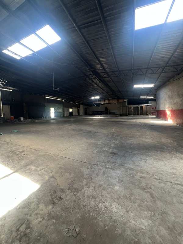 Empty industrial warehouse interior with concrete floor and skylights Chanis Panama