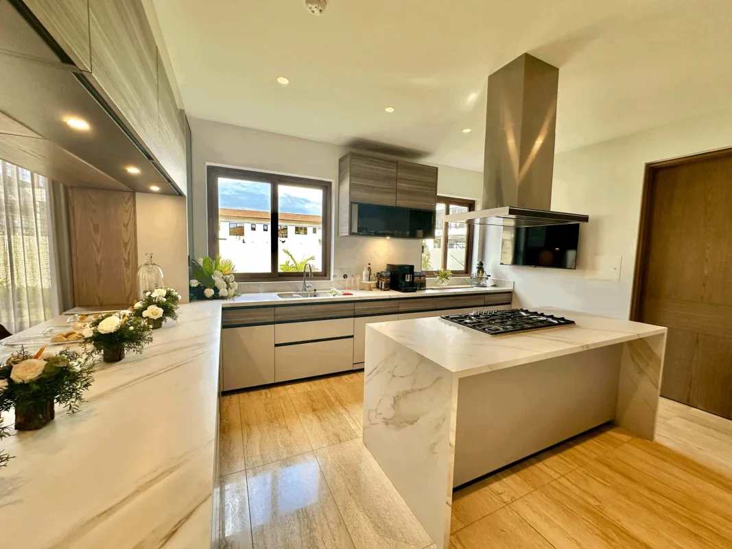 Spacious open living dining room with marble floors, large windows in The Woods Santa María Panama