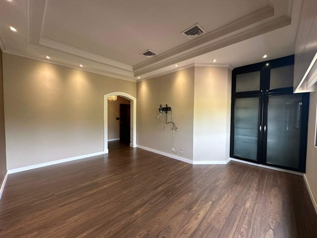 Large bedroom suite with hardwood flooring and natural light in PH Antigua Costa del Este Panama