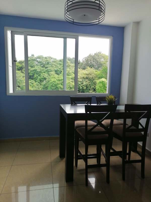 Open living dining space with ceramic tile floors, balcony view PH Urbis Tower Panama for sale